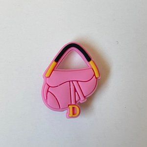 pink designer bag crocs charms